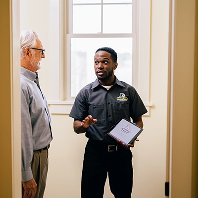 Technician speaking with customer.