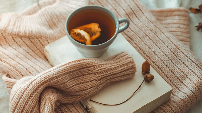 Sweater and tea cup.