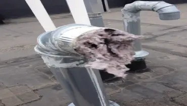 A picture of a clogged dryer vent.