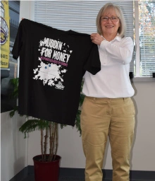 Tough mudder holding t-shirt